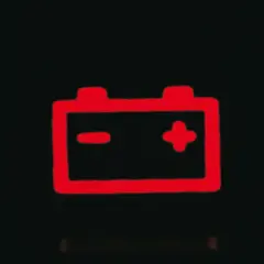 Czerwona ikona akumulatora na desce rozdzielczej podczas jazdy sygnalizuje problem z ładowaniem.