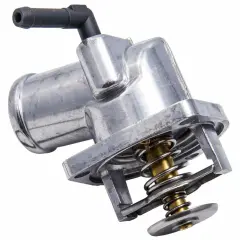 Metalowy termostat samochodowy z widocznym mechanizmem sprężynowym. Odpowiada za regulację temperatury silnika, a jego żywotność zależy od warunków pracy.