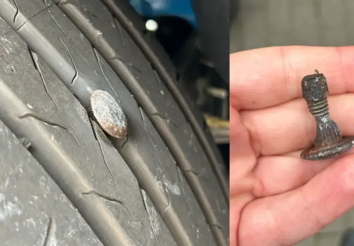 Gwoździu w oponie, który uszkodził włókno wzmacniające opony. Wyjęty z bieżnika, pokazuje ślady uszkodzeń.