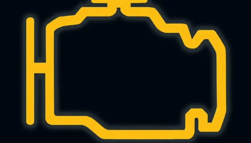 Żółty symbol silnika na czarnym tle. Oznacza problem z silnikiem, być może słabe paliwo. Check engine świeci.