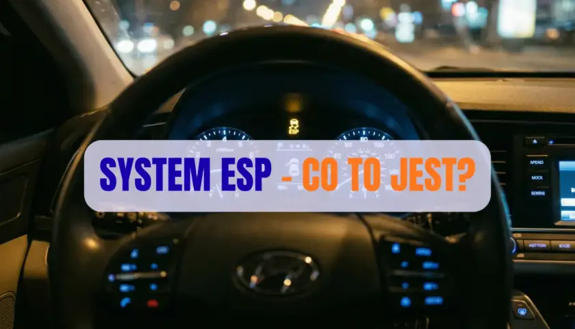 Widok z wnętrza auta nocą. Na desce rozdzielczej świeci się kontrolka ESP, a na ekranie tekst "SYSTEM ESP - CO TO JEST?".