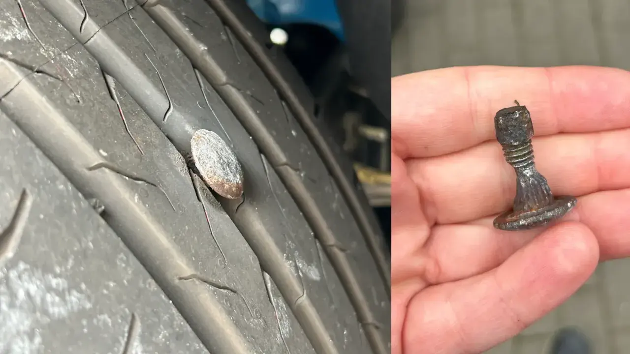Gwoździu w oponie, który uszkodził włókno wzmacniające opony. Wyjęty z bieżnika, pokazuje ślady uszkodzeń.